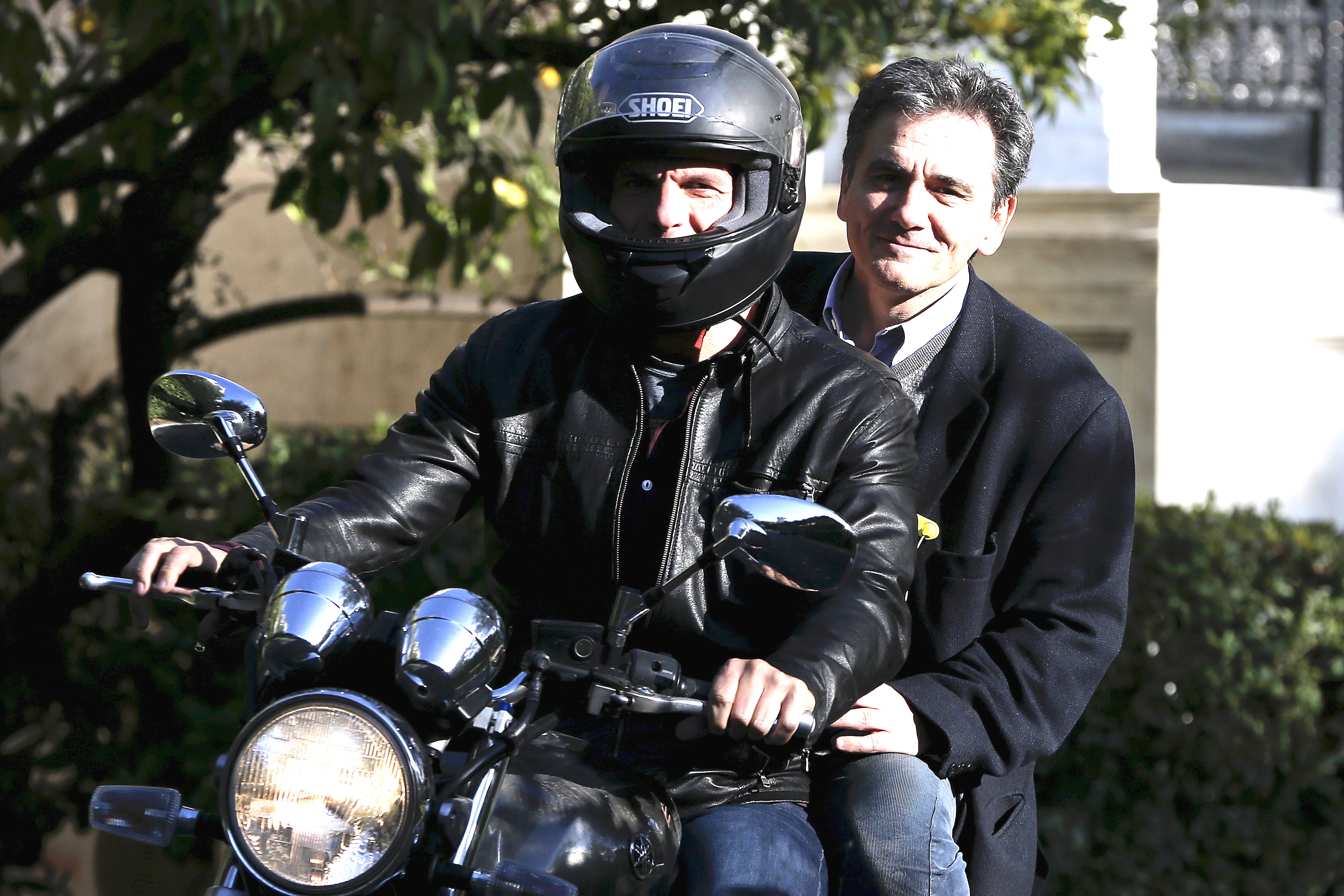 Greek Finance Minister Varoufakis and deputy minister for international economic relations Tsakalotos leave the Maximos Mansion after a meeting with PM Tsipras in Athens